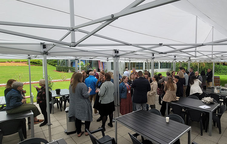 Attendees and community members at the barbecue finale. 